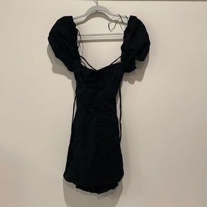 Black dress with puffed sleeves and cross cross back